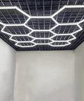 Plug In Hexagon LED Garage Light Kit With 8 Honeycomb Grid System, 34 Tubes, 210W, 6500K, aluminum body with customizable size installed in a ceiling