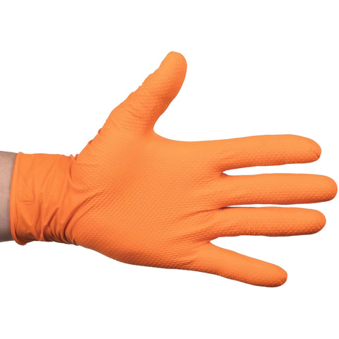 Nitrile disposable glove on hand, orange, side view, textured raised diamond grip.
