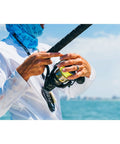 Angler using Battle III Inshore Spinning Reel With HT-100 Front Drag, 12 Lb Max Drag, Saltwater Ready, Black Gold Finish