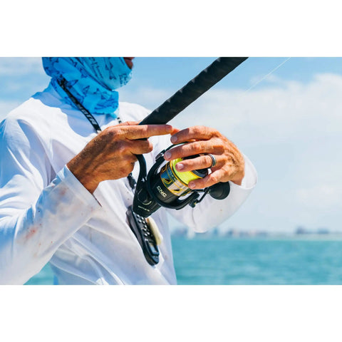 Angler using Battle III Inshore Spinning Reel With HT-100 Front Drag, 12 Lb Max Drag, Saltwater Ready, Black Gold Finish