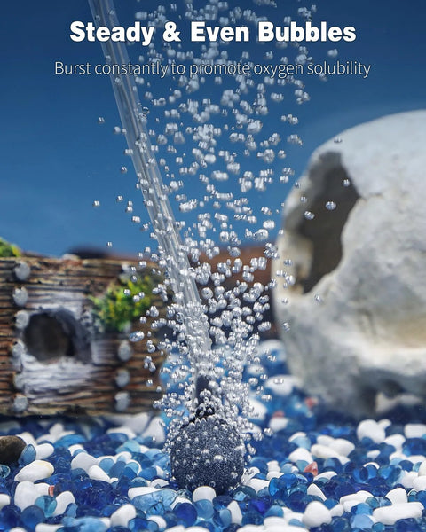 Pawfly aquarium air pump releasing bubbles in a small fish tank with blue and white gravel
