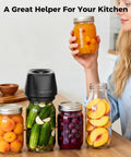 Upgraded 3-In-1 Electric Mason Jar Vacuum Sealer With Built In Converter For Regular And Wide Mouth Jars, Vacuum Bags, Containers, And Wine Bottles Efficient Kitchen Freshness Preservation Tool Black in use with jars of fruits and vegetables.