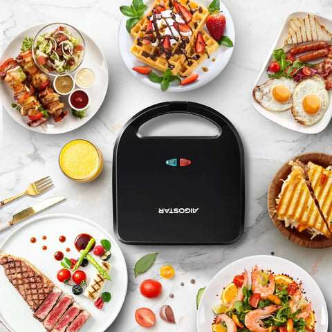 Aigostar 3 In 1 Electric Sandwich Maker With Removable Nonstick Plates on countertop surrounded by various delicious dishes.