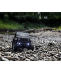 SCX24 Jeep Gladiator One Twenty Fourth Scale 4x4 Rock Crawler Ready To Run Brushed RC Car on a rocky trail