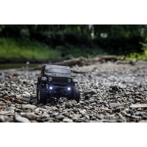 SCX24 Jeep Gladiator One Twenty Fourth Scale 4x4 Rock Crawler Ready To Run Brushed RC Car on a rocky trail