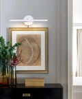 Sleek Plug In Vanity Light Bar For Bathroom Over Mirror, 15.75 Inches, mounted above framed art on white wall.