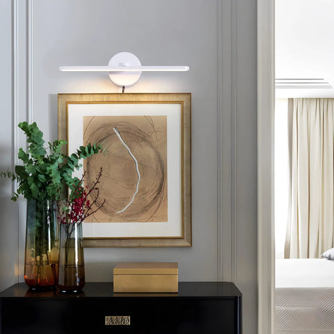 Sleek Plug In Vanity Light Bar For Bathroom Over Mirror, 15.75 Inches, mounted above framed art on white wall.