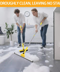 Two people using a Multi Purpose V Shaped Grout Brush And Floor Squeegee Set With 16.9 Inch Long Handles in a soapy kitchen.