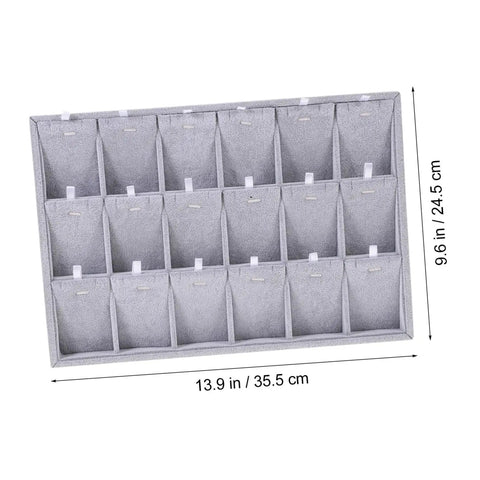 Lowkey Perfect Multi Grid Jewelry Tray For Rings And Necklaces With Smart Dividers, measuring 13.9 x 9.6 in, in dark gray fabric.