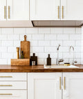 3 Inch Solid Brass Cabinet Pulls Round Bar Handles Brushed Gold 4 Pack installed on kitchen cabinets