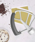 Top view of Flex Edge Beater Replacement for KitchenAid Tilt-Head Stand Mixers, 4.5-5 Quart, white with metal alloy frame.