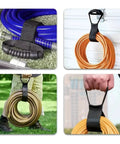 Versatile 17 Inch Adjustable Black Nylon Storage Strap With Ergonomic Handle For Cords Garden Hoses Swimming Gear And Garage Tools Heavy Duty Organizer With Strong Velcro For Reusable Easy Grab And Go Neat Storage securing hoses and cables in various settings.