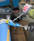 Top Shelf Center Punch Installer With Built In Cutter For 5/8 And 3/8 Inch Hose Clamps being used on a blue flexible hose.