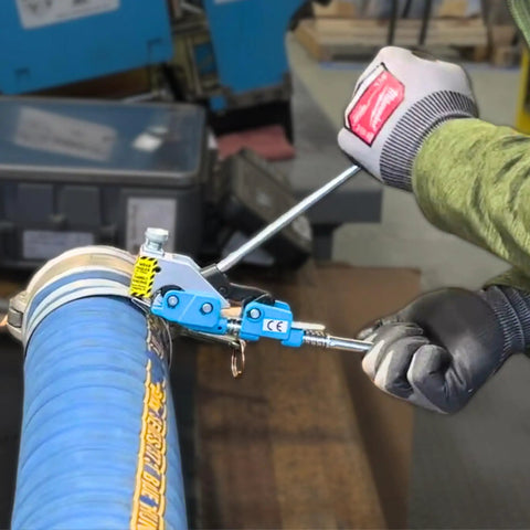 Top Shelf Center Punch Installer With Built In Cutter For 5/8 And 3/8 Inch Hose Clamps being used on a blue flexible hose.