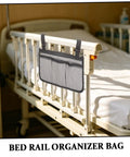Bed Rail Organizer With Four Pockets And Cup Holder, Hanging Bedside Storage Caddy in Gray Fabric attached to hospital bed rail.
