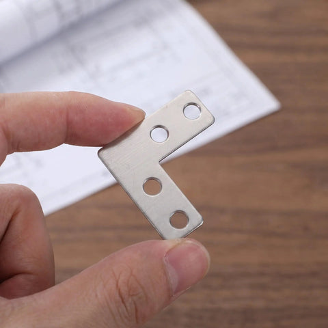 Close-up of Heavy Duty Stainless Steel L Bracket Corner Brace 1.6x1.6 Inch Right Angle Support Connector held in fingers