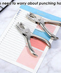 Two Piece Handheld Hole Punch Set With One Quarter Inch And One Eighth Inch Circle Punches on notebook