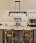 Top Shelf Black Five Light Linear Chandelier Featuring A Killer Geometric Metal Frame And Adjustable Hanging Rods For Down To Earth Farmhouse Kitchen Islands And Dining Spaces above a kitchen island with two wooden stools.