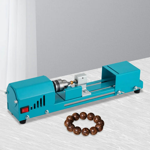 96W Portable Mini Wood Lathe Machine For Beads And Carving With Milling Accessories Wide Voltage 110V To 240V Us Plug For DIY Woodworking Projects, teal color, positioned over a white surface with wooden beads.