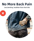 Person in blue denim jacket and dark pants, seen from behind with hand on lower back.