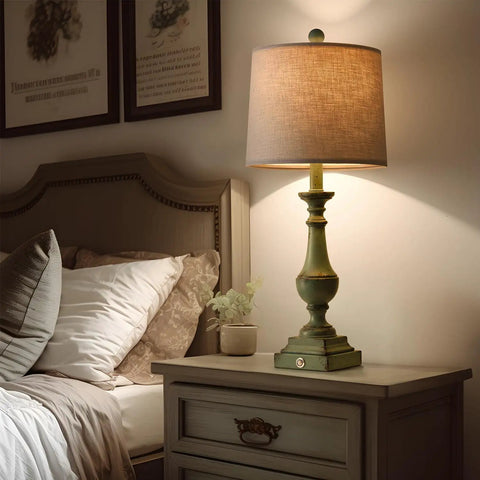 Three Way Dimmable Touch Table Lamps Set Of Two With USB Ports For Quick Phone Charging Ideal For Bedroom Nightstand Or Living Room Rustic Green Finish And Modern Look shown beside bed on nightstand
