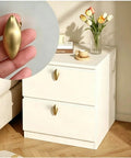 Top Shelf Brushed Brass Oval Cabinet Knobs And Zinc Alloy Single Hole Drawer Pulls Featuring Warm Olive Tones Four Pack shown on drawer.