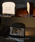 Toast Shaped Night Light with Cute Smile Face featuring single and double-sided LED lighting, used as phone holder.