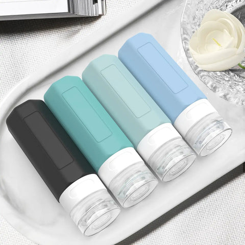 Leak Proof 3oz Travel Bottles TSA Approved Refillable Silicone Containers For Toiletries BPA Free lined on a tray