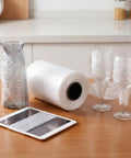 Air Cushion Wrap Roll 984ft Inflatable Bubble Cushions For Packaging And Shipping Supplies on table with wrapped glassware