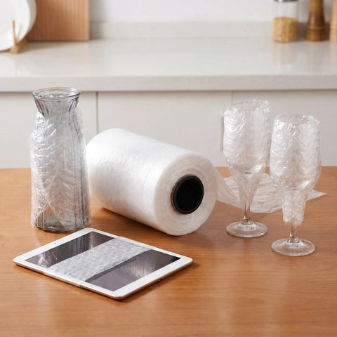 Air Cushion Wrap Roll 984ft Inflatable Bubble Cushions For Packaging And Shipping Supplies on table with wrapped glassware