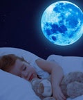 Child sleeps under blue moon from 1088 Piece Glow In The Dark Stars And Moon Wall Decals Kit For Kids Room Ceiling Night Sky Decor Bright Long