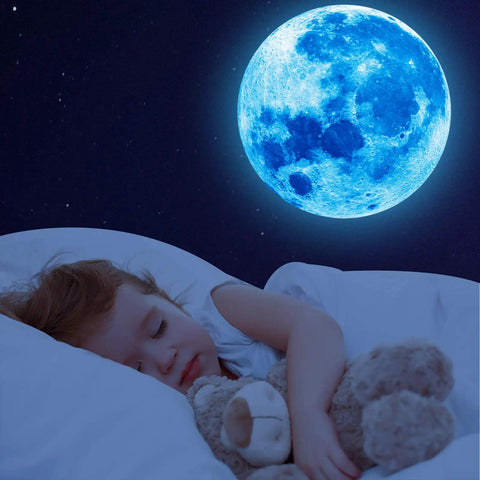 Child sleeps under blue moon from 1088 Piece Glow In The Dark Stars And Moon Wall Decals Kit For Kids Room Ceiling Night Sky Decor Bright Long