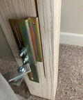 Close-up of 2 Pack Heavy Duty Model 711 Headboard Adapter Brackets on a metal bed frame, showcasing installation details.