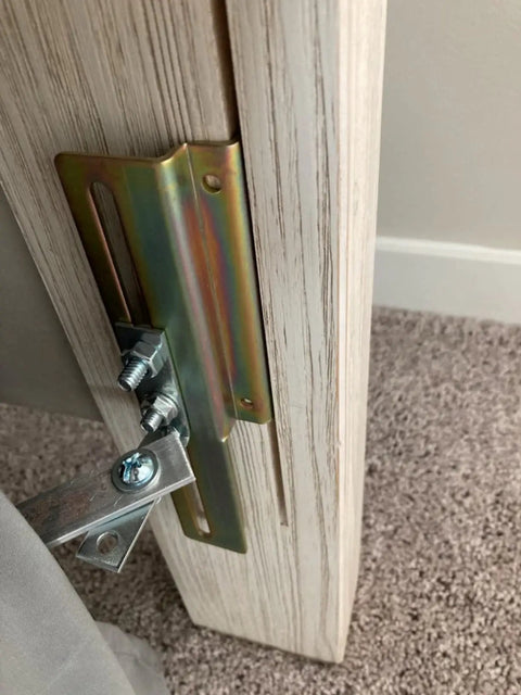 Close-up of 2 Pack Heavy Duty Model 711 Headboard Adapter Brackets on a metal bed frame, showcasing installation details.