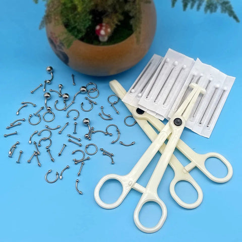 84 Piece Body Piercing Kit With 14G And 16G Jewelry For Nose Tongue Lip Ear Eyebrow Belly Button Cartilage Tragus Industrial Helix Daith Clamps And Tools Complete Starter Set For Piercing Fans shown with jewelry and tools.