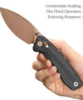 Hand holding Koala Plus-BM Folding Knife With 2.99 Inch Blade For EDC And Camping, 14C28N Stainless Steel, black micarta handle