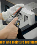 Worker using mini belt sander with Half Inch By Eighteen Inch Aluminum Oxide Sanding Belts 20 Pack 150 Grit
