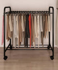 No Sweat Expanding Floor Standing Pants Hanger Rack Built For Glide Like Silk Motion On Hardwood Tile Floors With Secure Locking Brakes and Serious Closet Organization Perks with neatly hung pants.