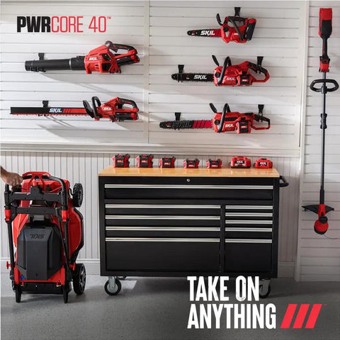 Top Shelf 40V Brushless Self Propelled Lawn Mower With 20 Inch Cutting Deck And Smart Caddy Storage features displayed on a tool bench.