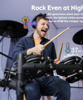 Man playing Groove Electric Drum Kit with 8 inch double layer mesh pads, silent practice, headphones, and foldable design.