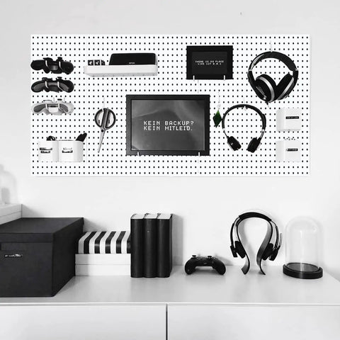 Double Pack Metal Pegboard Panels for Walls with gadgets, headphones, and decor in a white finish for office storage