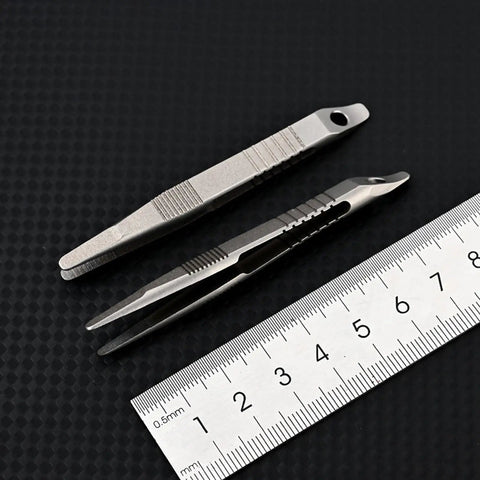 Alloy Pocket Tweezers For Camping And Hiking Gear next to ruler, compact rust-resistant tool for travel