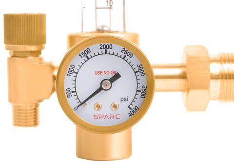 SPARC argon welding gas regulator with brass body and round psi gauge.
