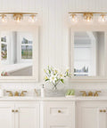 Three Light Gold Vanity Light Fixture With Clear Globe Glass Shades And Slim Taper Arm For Modern Bathroom Decor