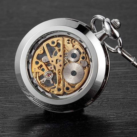 Mens Classic Steampunk Pocket Watch Gold Skeleton Hand Wind Mechanical Timepiece with visible gears on dark surface