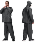Mens Heavy Duty Waterproof Rain Suit Three Piece Set Featuring Pu Coated Jacket And Relaxed Fit Pants on model in grey.