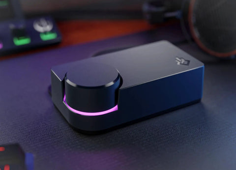 USB XLR Audio Interface For Creators With Built In DSP Mic Chain, Ultra Low Noise Preamp, dark finish on desk setup.