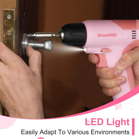 Pink Cordless Drill Kit With Three-Eighths Inch Keyless Chuck and Built-In LED being used for drilling a lock on a door.