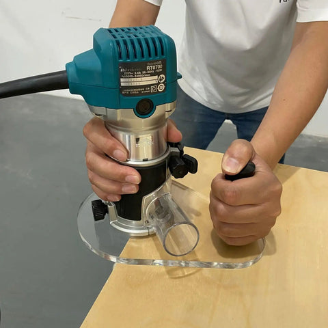 Close-up of Super Slick Clear Acrylic Router Base Plate For RT0701C And XTR01Z in use on a wood surface.