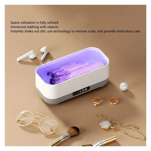 Portable Ultrasonic Cleaner With Rechargeable Battery For Jewelry And Watches One Touch Control showing inside tank with rings and glasses.